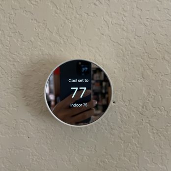The new Google Nest thermostat that allows you to adjust the temperature on your phone and away from home.