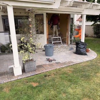 Removal of kitchen window to install French doors from sitting area