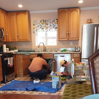 Max removing disposal and Nick getting the new one ready.
