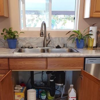 Beautiful new disposal nicely installed by Sam's Handyman Services.