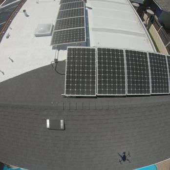 new shingles tied into flat roof