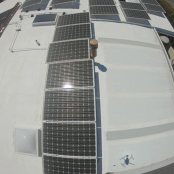 fixed leaks between the flat roof and recently installed aluminum roof