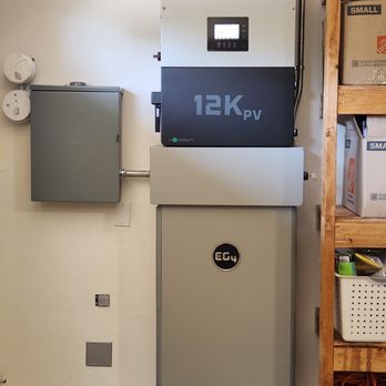 EG4 12Kpv inverter (top), EG4 14kWh LifePo4 battery (bottom), sub-panel (left)