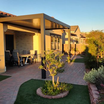 Patio cover, attached to home on one side, with posts on the outside.